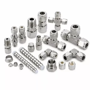 Various stainless steel Hastelloy tube fittings on white background