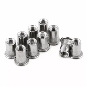 A group of stainless steel blind nuts, also known as rivet nuts, on a white background.