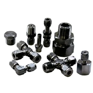 Assortment of stainless steel tube fittings, including tees, elbows, and caps.