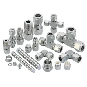 Assortment of stainless steel tube fittings, including ferrules, nuts, elbows, tees, and couplings.